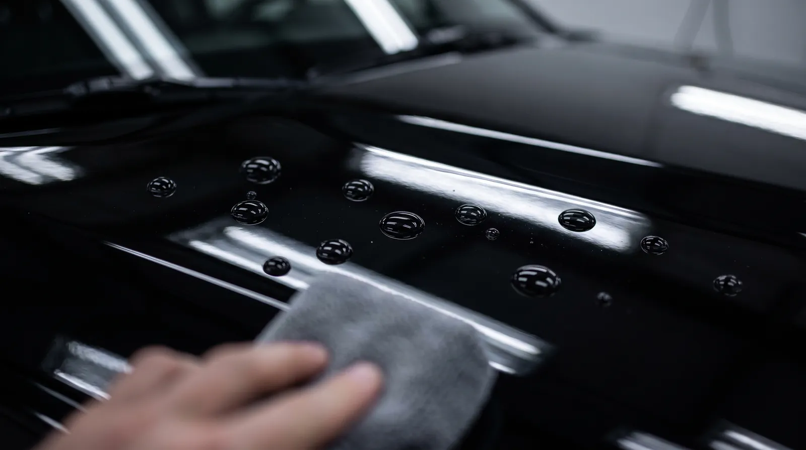 Water beading on black paint after ceramic coating in San Diego Water beading on black paint after ceramic coating in San Diego