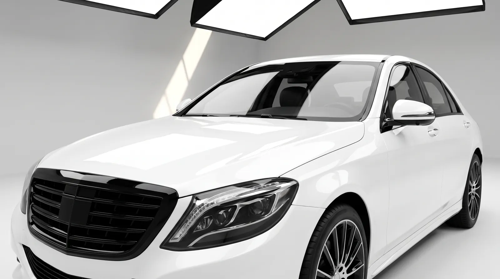 White luxury sedan with gloss black chrome delete grille and trim White luxury sedan with gloss black chrome delete grille and trim